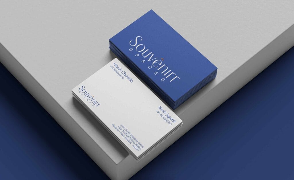 Souvenirr Spaces business card design in primary blue and cream