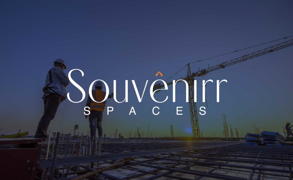 Souvenirr Spaces final wordmark logo in primary blue with orange chevron mark